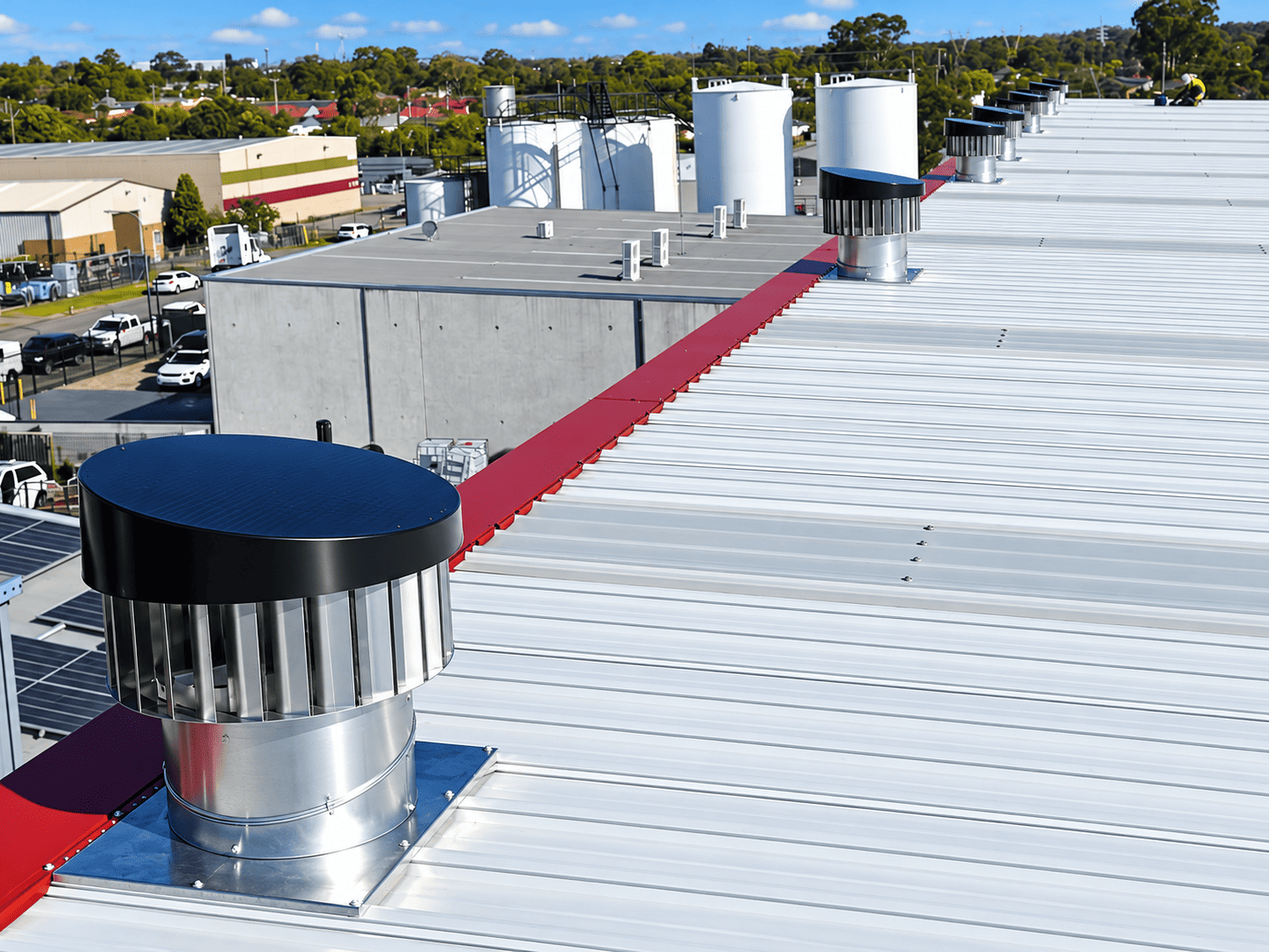 iSwirl 450 solar-and-wind ventilators installed on an industrial roof